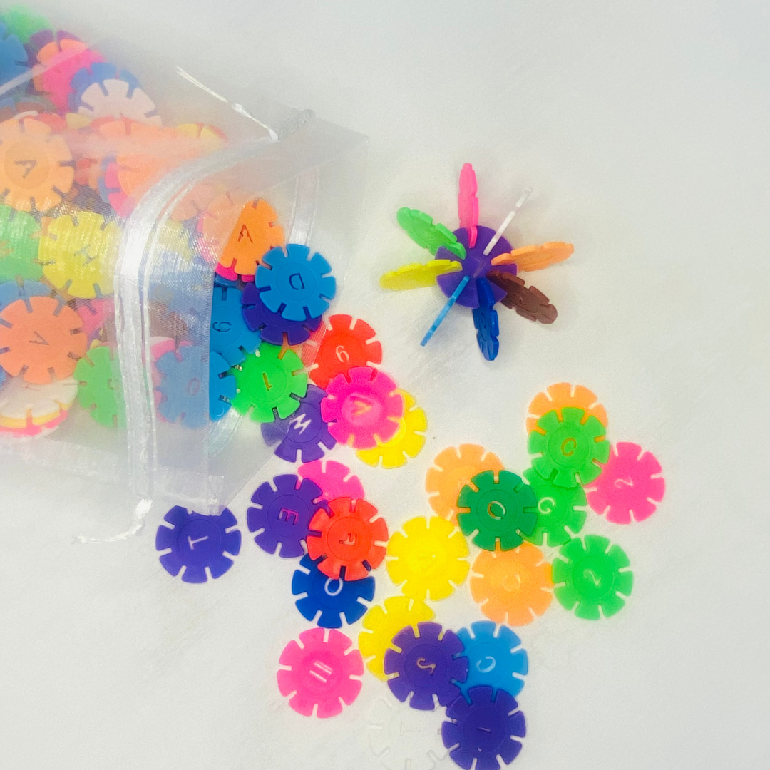 Colorful snowflake discs with notched in sides for snapping together and building designs. Each circle is 1.3 in. in diameter. Great building toy! Fun Learn Grow Co.