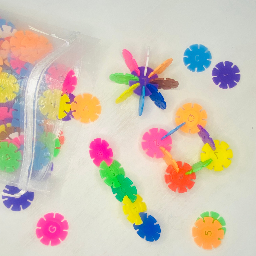 Colorful snowflake discs with notched in sides for snapping together and building designs. Each circle is 1.3 in. in diameter. Great building toy!