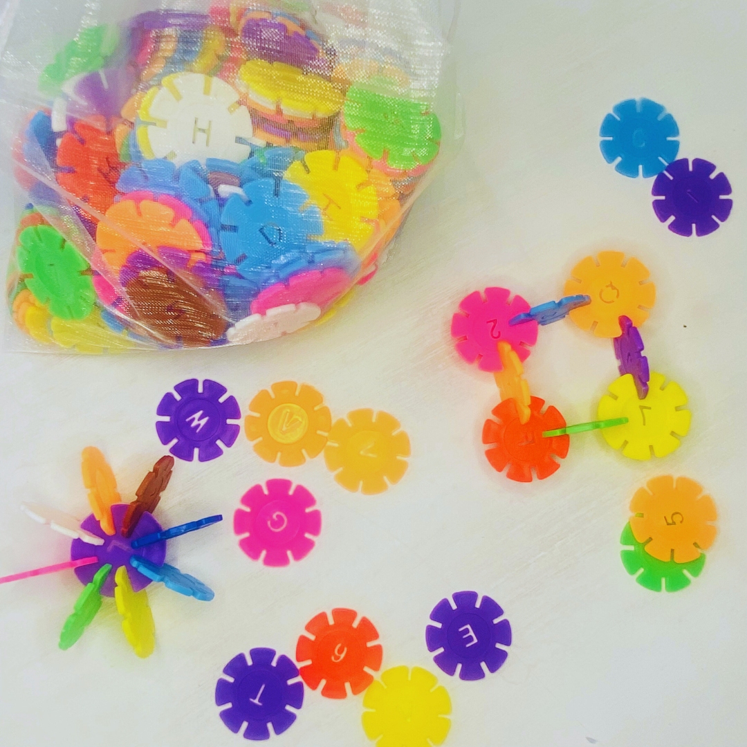 Colorful snowflake discs with notched in sides for snapping together and building designs. Each circle is 1.3 in. in diameter. Great building toy! Fun Learn Grow Co.