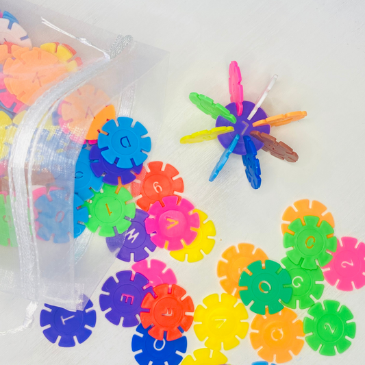 Colorful snowflake discs with notched in sides for snapping together and building designs. Each circle is 1.3 in. in diameter.  Fun Learn Grow Co.
