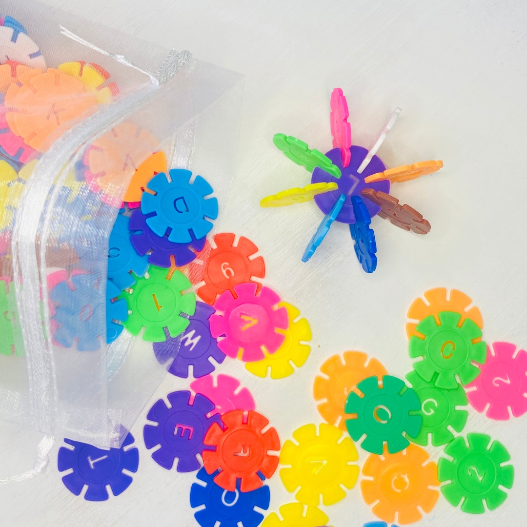 Colorful snowflake discs with notched in sides for snapping together and building designs. Each circle is 1.3 in. in diameter. 